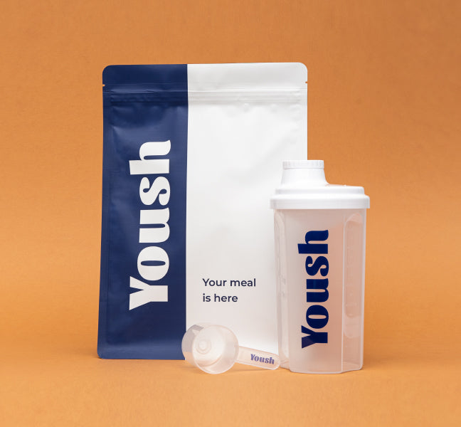 yoush product in box with transparent shaker and spoon on orange background